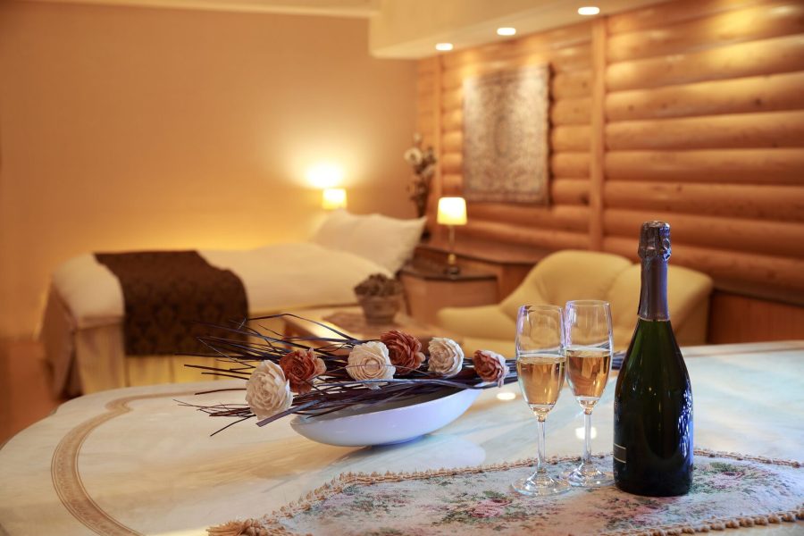 Log-cabin style room at Hotel Fine Garden Umeda set with sparkling wine and glasses